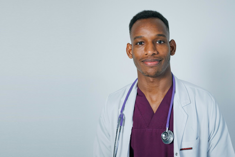 young surgeon in coat